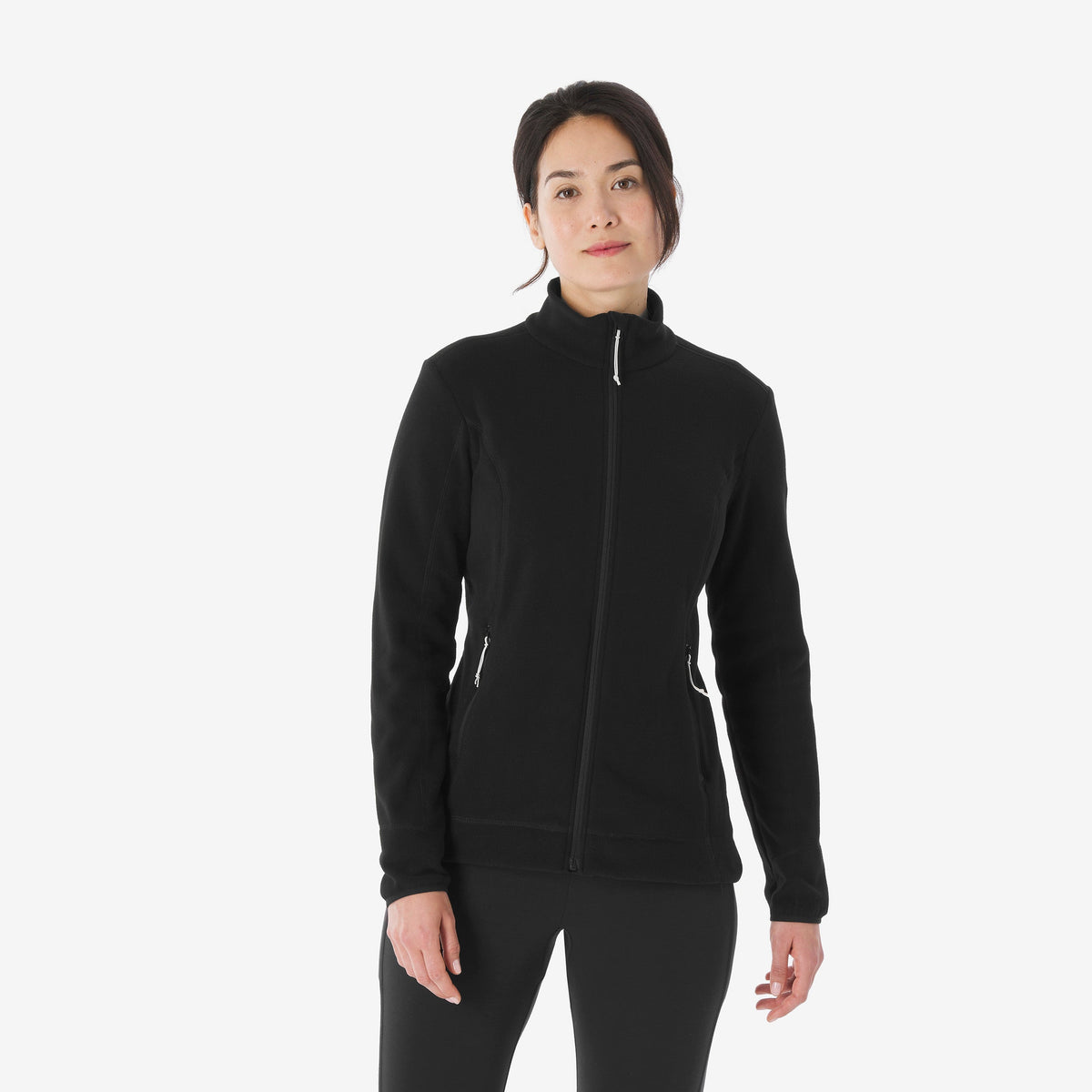 Woman wearing a black zip-up hoodie on a white background